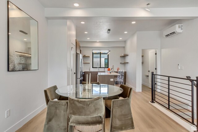 4186 S Main St Unit N220, Millcreek, UT 84107 - dining room with a wall unit AC, light wood-style floors, recessed lighting, and baseboards