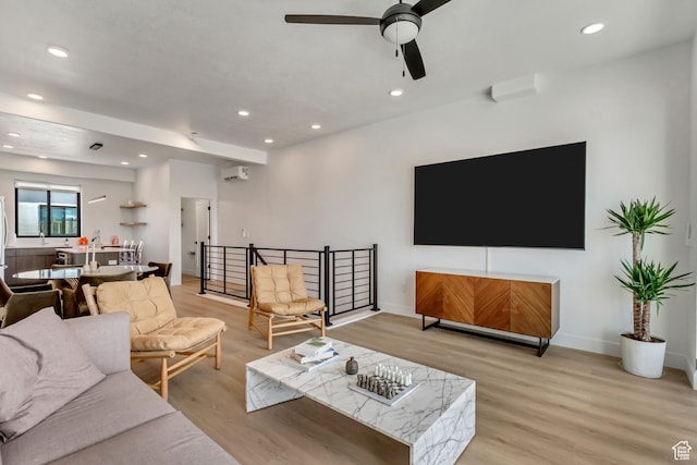 4186 S Main St Unit N220, Millcreek, UT 84107 - living area featuring light wood finished floors, a ceiling fan, recessed lighting, an AC wall unit, and baseboards