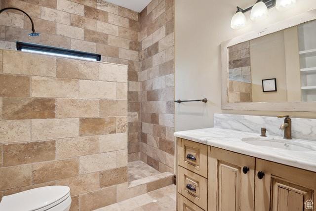 4891 Last Stand Dr, Snyderville, UT 84098 - bathroom with tiled shower, vanity, and toilet