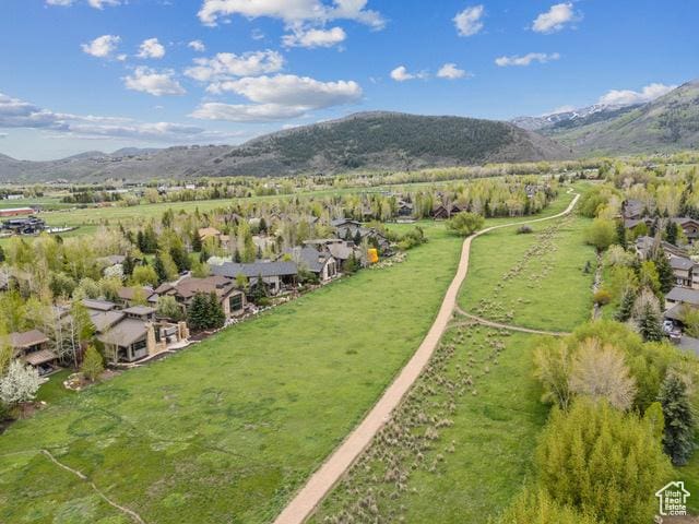 4891 Last Stand Dr, Snyderville, UT 84098 - aerial view of property and surrounding area featuring a mountain backdrop, nearby suburban area, and rural landscape