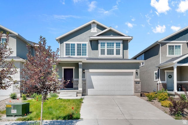 1689 S Haven Pkwy, West Haven, UT 84401 - view of front facade with an attached garage, stucco siding, and driveway