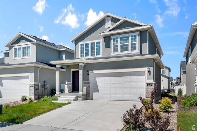 1689 S Haven Pkwy, West Haven, UT 84401 - view of front of house featuring an attached garage, stucco siding, concrete driveway, and stone siding