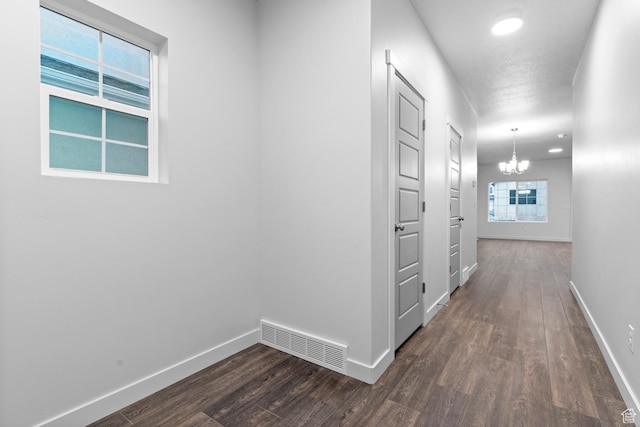 1689 S Haven Pkwy, West Haven, UT 84401 - hallway featuring dark wood-style flooring, a chandelier, baseboards, and recessed lighting