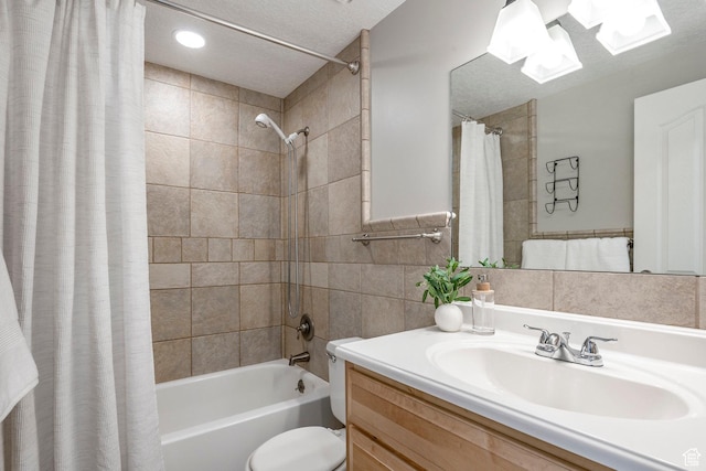 1180 W Middlesex Rd S, Taylorsville, UT 84123 - full bath featuring shower / bath combo with shower curtain, vanity, toilet, a textured ceiling, and tile walls