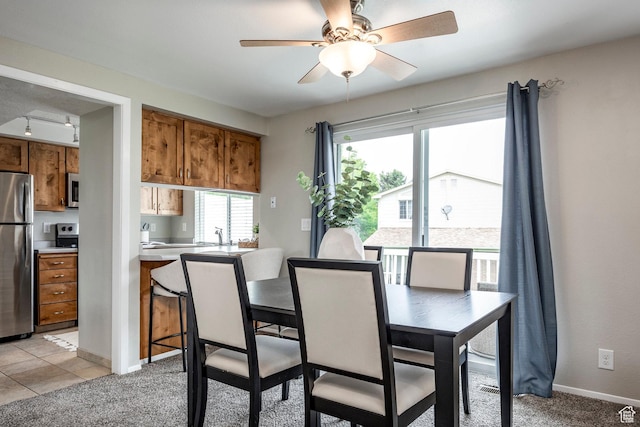 1180 W Middlesex Rd S, Taylorsville, UT 84123 - dining space with ceiling fan, baseboards, and light carpet