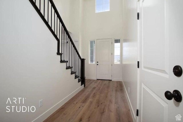 4883 N 10 E, Enoch, UT 84721 - entrance foyer with baseboards, wood finished floors, stairway, and a towering ceiling