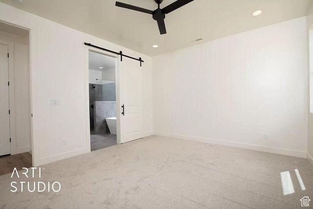 4883 N 10 E, Enoch, UT 84721 - unfurnished bedroom featuring carpet floors, a barn door, baseboards, recessed lighting, and ensuite bath