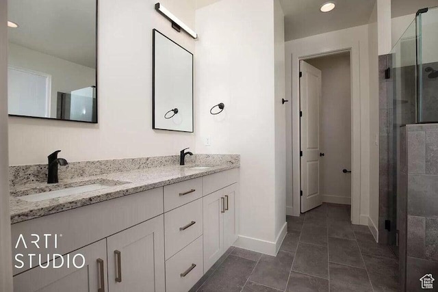 4883 N 10 E, Enoch, UT 84721 - full bathroom featuring a stall shower, baseboards, double vanity, and recessed lighting