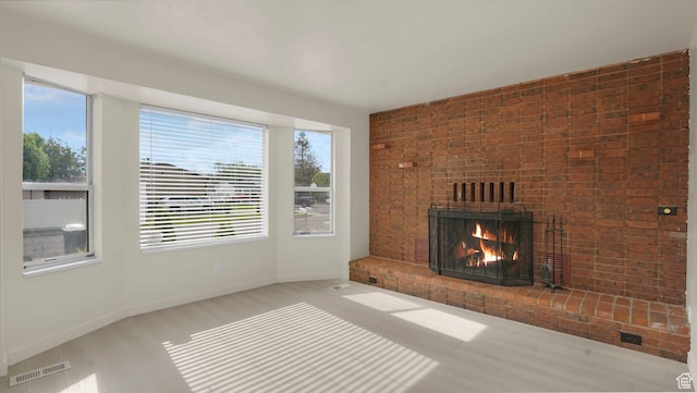 2976 S Laree St, West Valley City, UT 84120 - unfurnished living room with plenty of natural light, a fireplace, and baseboards