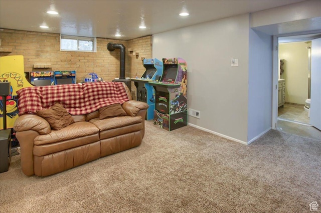 708 Robins Ave, Ogden, UT 84404 - living area with carpet floors, recessed lighting, baseboards, a wood stove, and brick wall
