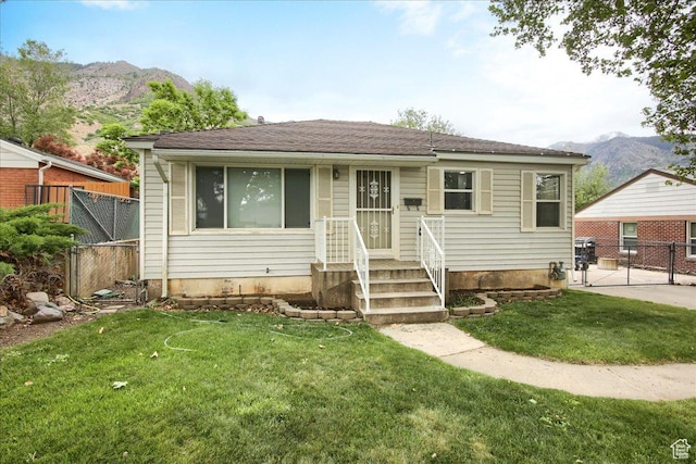 708 Robins Ave, Ogden, UT 84404 - bungalow-style house with a mountain view and a gate
