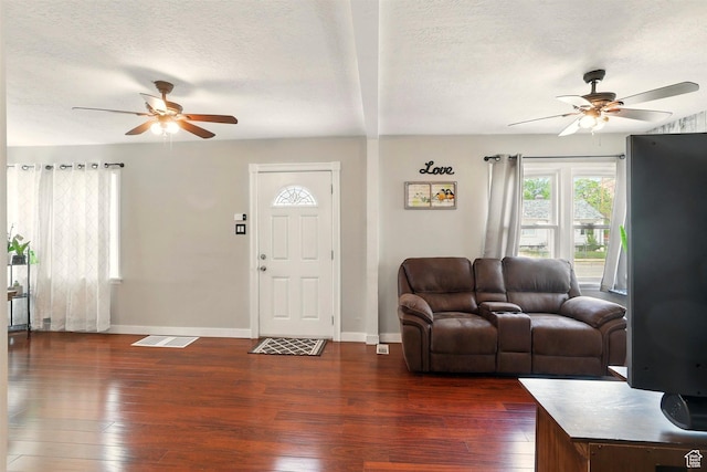 575 5th St, Ogden, UT 84404 - living area featuring a ceiling fan, dark wood-type flooring, baseboards, and a textured ceiling