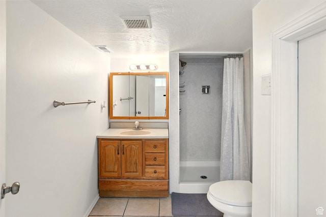 575 5th St, Ogden, UT 84404 - full bath with a stall shower, tile patterned floors, toilet, vanity, and a textured ceiling