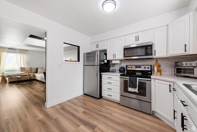 88 W 50 S Unit L5, Centerville, UT 84014 - kitchen with appliances with stainless steel finishes, light countertops, and white cabinetry