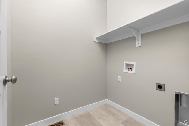 washroom featuring washer hookup, electric dryer hookup, and baseboards