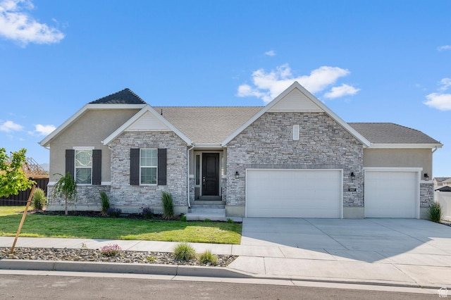 5667 N Parkview Dr, Stansbury Park, UT 84074 - view of front of house with a garage, a front lawn, stone siding, and driveway