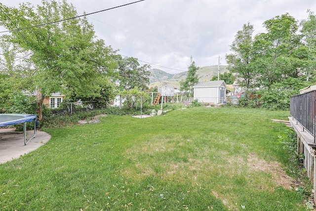 263 E 1350 N, Bountiful, UT 84010 - view of yard featuring a trampoline and a mountain view