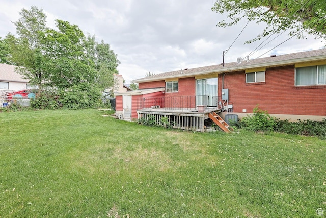 263 E 1350 N, Bountiful, UT 84010 - rear view of house with a lawn, brick siding, and a deck