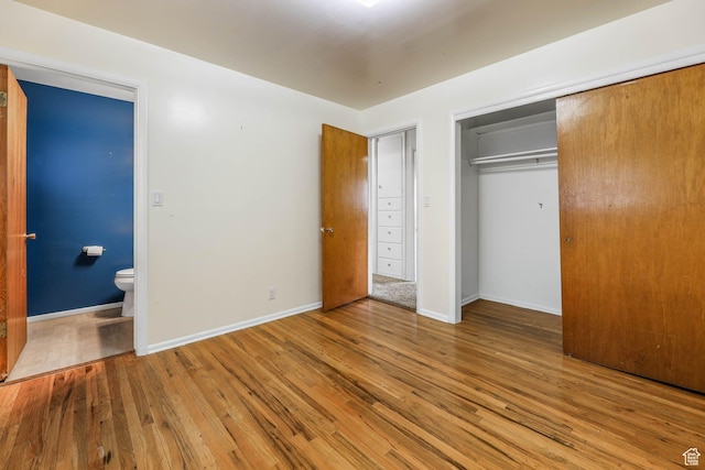 263 E 1350 N, Bountiful, UT 84010 - unfurnished bedroom featuring wood finished floors, a closet, baseboards, and ensuite bathroom
