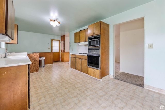 263 E 1350 N, Bountiful, UT 84010 - kitchen featuring black oven, a sink, built in microwave, and brown cabinetry