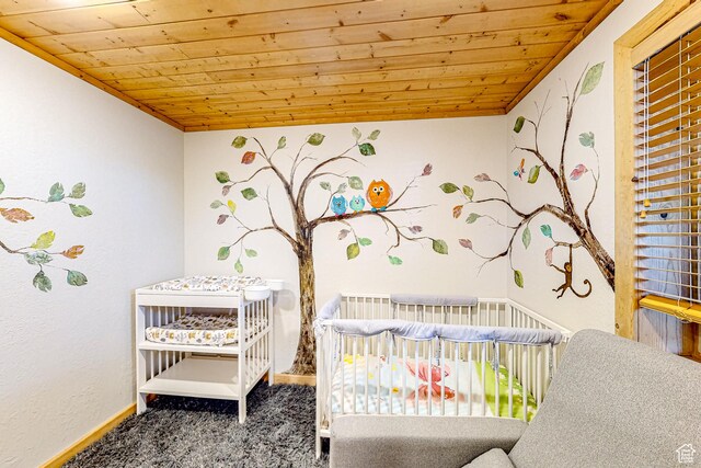 450 Crestview Dr, Summit Park, UT 84098 - carpeted bedroom featuring wood ceiling, baseboards, and a nursery area