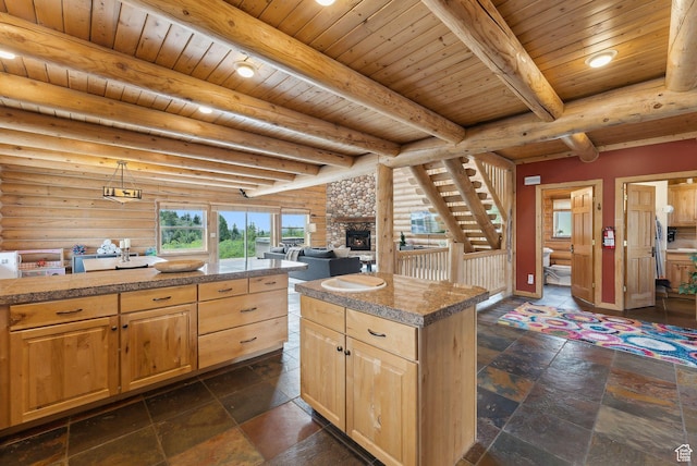 450 Crestview Dr, Summit Park, UT 84098 - kitchen featuring tile counters, light brown cabinets, wooden ceiling with exposed beams, a stone fireplace, and log walls