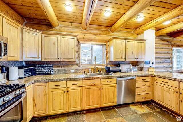 450 Crestview Dr, Summit Park, UT 84098 - kitchen featuring appliances with stainless steel finishes, tile countertops, light brown cabinetry, a sink, and log walls