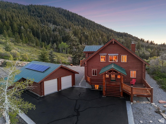 450 Crestview Dr, Summit Park, UT 84098 - cabin with a wooded view, log siding, a garage, and an outbuilding