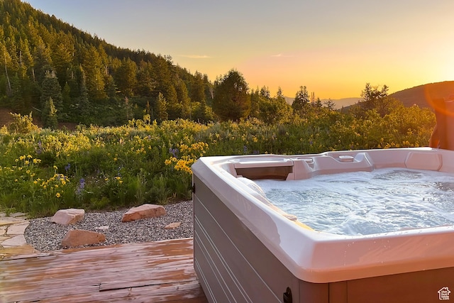 450 Crestview Dr, Summit Park, UT 84098 - wooden deck featuring a hot tub and a wooded view