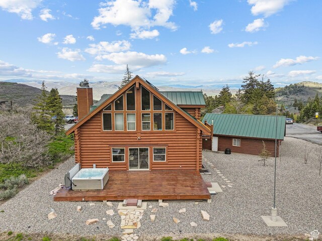 450 Crestview Dr, Summit Park, UT 84098 - rear view of property with log siding, a chimney, a deck with mountain view, and metal roof