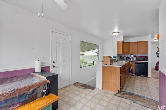 3466 W 4305 S, West Valley City, UT 84119 - kitchen featuring light floors, dishwasher, light countertops, a sink, and brown cabinets