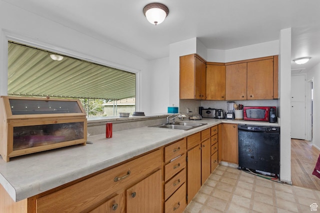 3466 W 4305 S, West Valley City, UT 84119 - kitchen with dishwasher, a sink, light countertops, brown cabinetry, and light floors