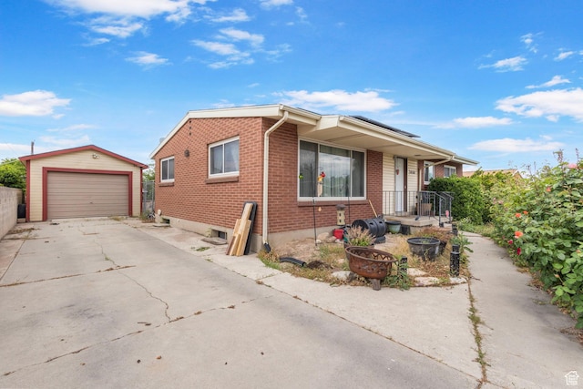 3466 W 4305 S, West Valley City, UT 84119 - view of front facade featuring an outbuilding, brick siding, a garage, and concrete driveway