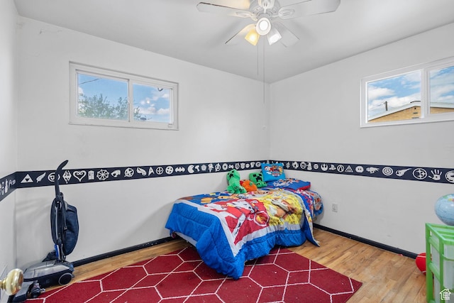 3466 W 4305 S, West Valley City, UT 84119 - bedroom with wood finished floors, baseboards, and a ceiling fan