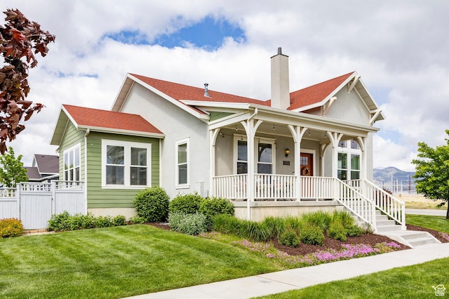 10352 S Sturgeon Dr W, South Jordan, UT 84009 - bungalow with covered porch, a chimney, stucco siding, and a mountain view