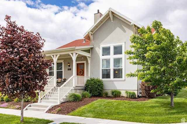 10352 S Sturgeon Dr W, South Jordan, UT 84009 - bungalow with a chimney, stucco siding, a front yard, and a porch