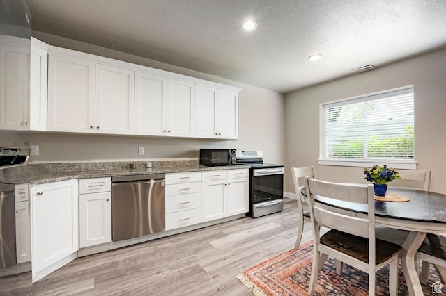 10352 S Sturgeon Dr W, South Jordan, UT 84009 - kitchen featuring appliances with stainless steel finishes, recessed lighting, light wood-style flooring, a textured ceiling, and white cabinets