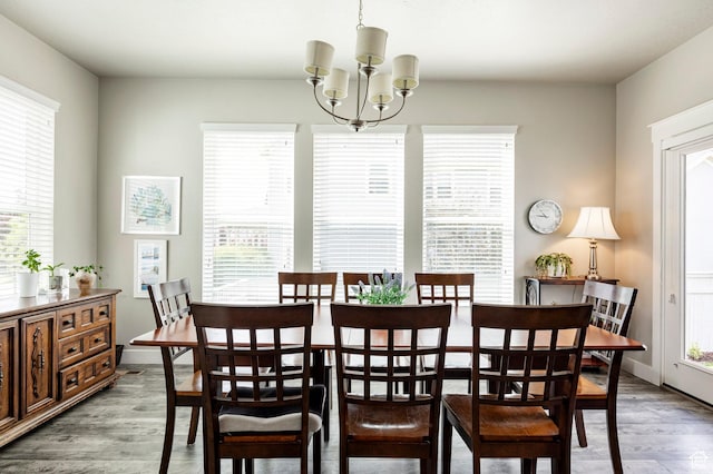 10352 S Sturgeon Dr W, South Jordan, UT 84009 - dining room with wood finished floors, a chandelier, and baseboards