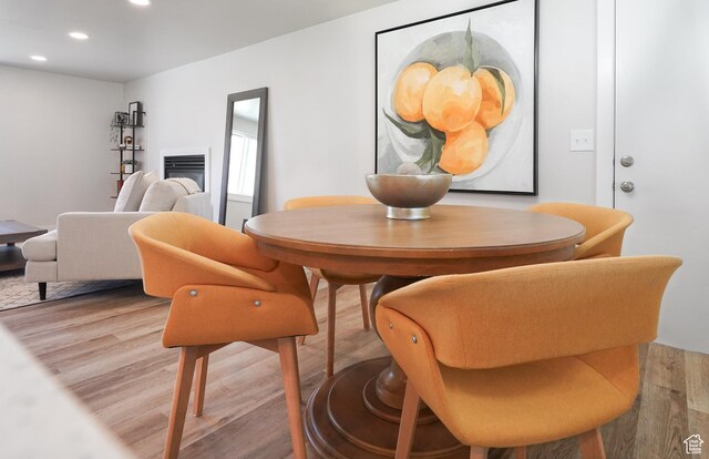 2612 S 8590 W, Magna, UT 84044 - dining area with wood finished floors, recessed lighting, and a glass covered fireplace