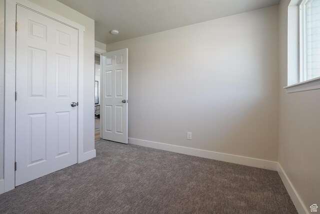 2612 S 8590 W, Magna, UT 84044 - unfurnished bedroom with carpet flooring and baseboards