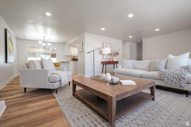 2612 S 8590 W, Magna, UT 84044 - living room with light wood finished floors, a chandelier, recessed lighting, and baseboards