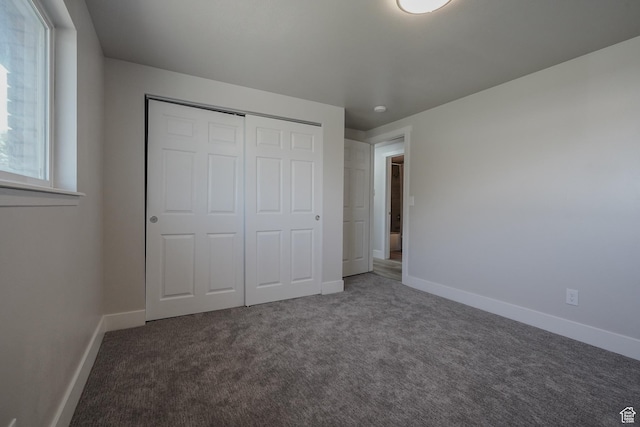 2612 S 8590 W, Magna, UT 84044 - unfurnished bedroom with carpet, a closet, and baseboards
