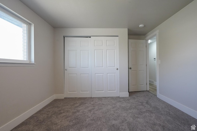 2612 S 8590 W, Magna, UT 84044 - unfurnished bedroom with carpet, a closet, and baseboards