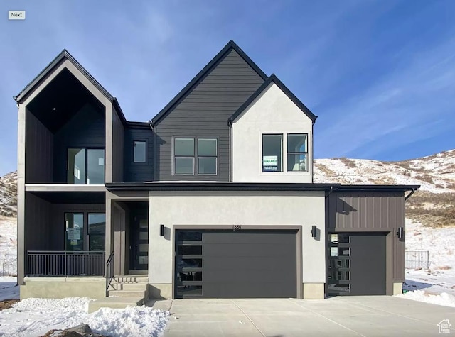 5894 N Canyon Rim Rd E Unit 621, Lehi, UT 84043 - contemporary home with a mountain view, a garage, driveway, and stucco siding