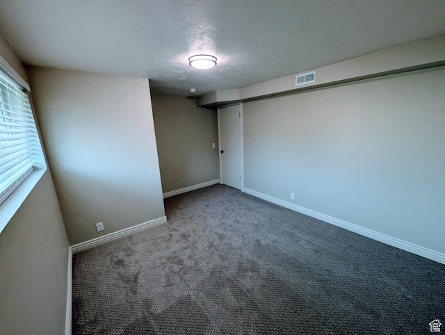 1391 E Mccormick Way, Cottonwood Heights, UT 84121 - carpeted empty room featuring baseboards and a textured ceiling