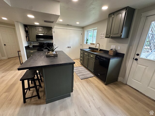 1391 E Mccormick Way, Cottonwood Heights, UT 84121 - kitchen with black appliances, dark countertops, a sink, light wood-style floors, and recessed lighting