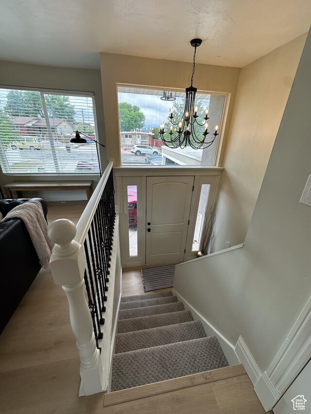 1391 E Mccormick Way, Cottonwood Heights, UT 84121 - staircase with a chandelier and wood finished floors