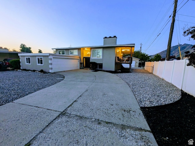 1391 E Mccormick Way, Cottonwood Heights, UT 84121 - view of front of house featuring a chimney and concrete driveway