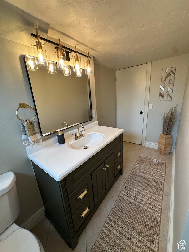 1391 E Mccormick Way, Cottonwood Heights, UT 84121 - bathroom featuring toilet, vanity, tile patterned flooring, baseboards, and a textured ceiling