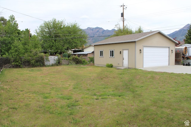 1391 E Mccormick Way, Cottonwood Heights, UT 84121 - view of yard with a detached garage, a mountain view, and an outdoor structure